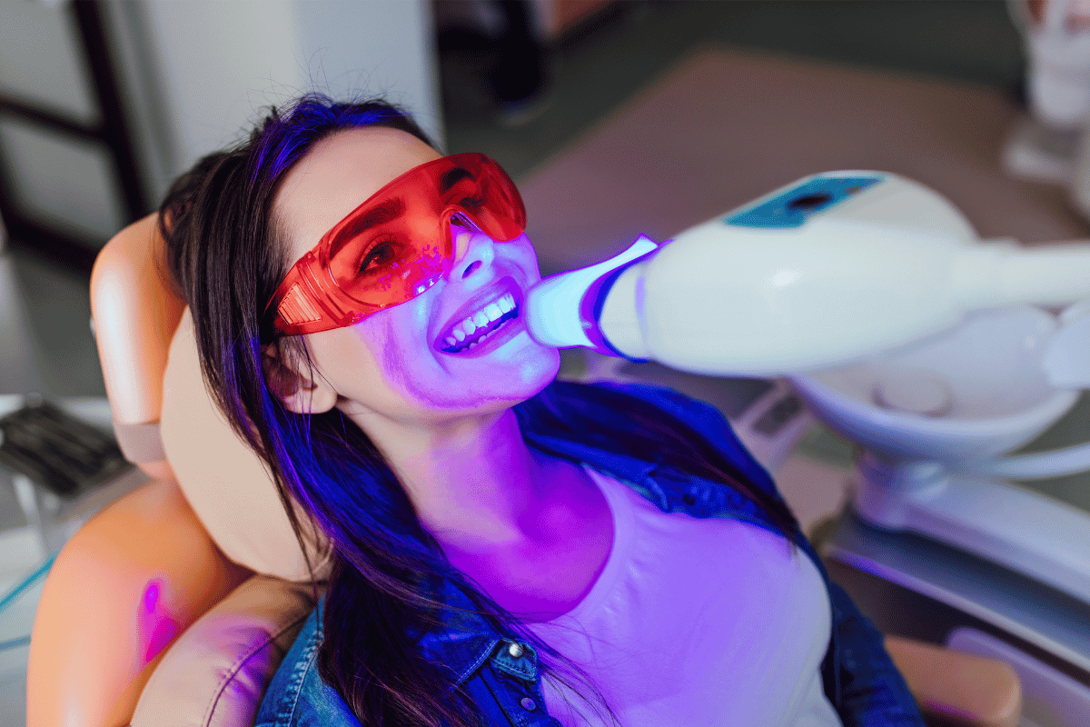 A woman receiving teeth whitening treatment 
